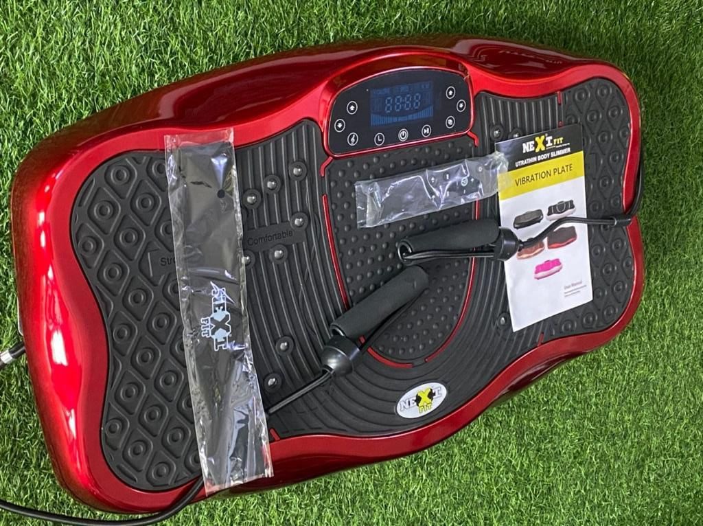 Red Vibration Machine on Grass